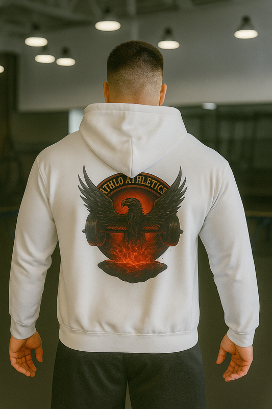 Person wearing a white hoodie with a logo on the back in an indoor setting
